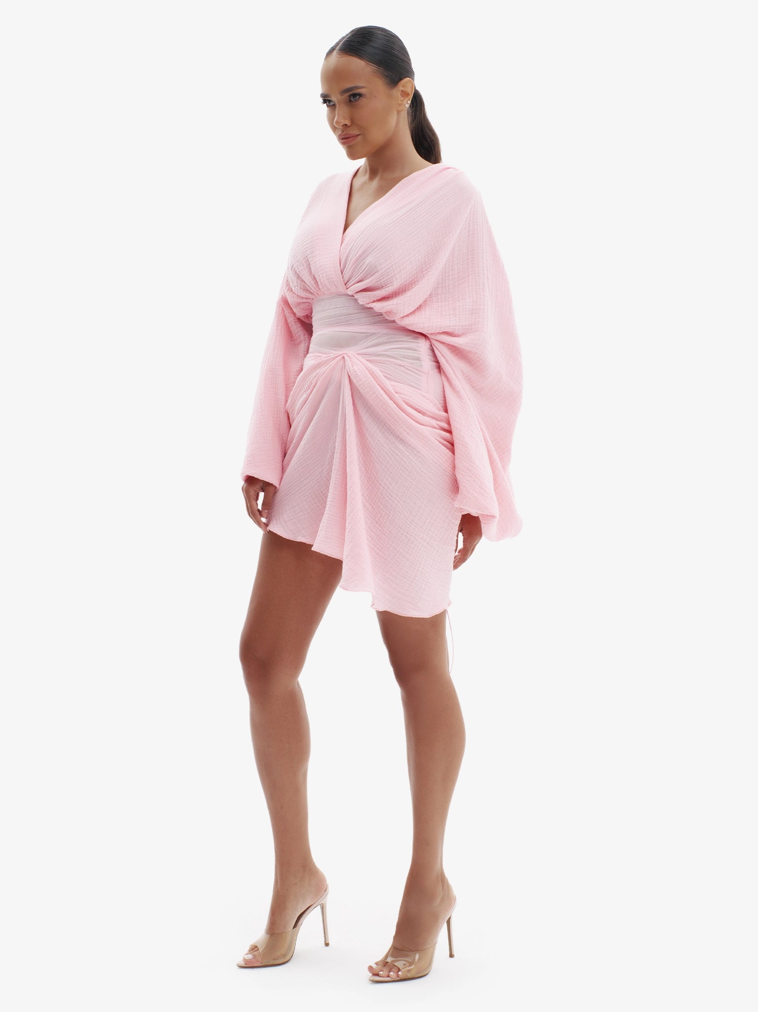 Pink draped dress with cinched waist, flattering minimalist elegance.