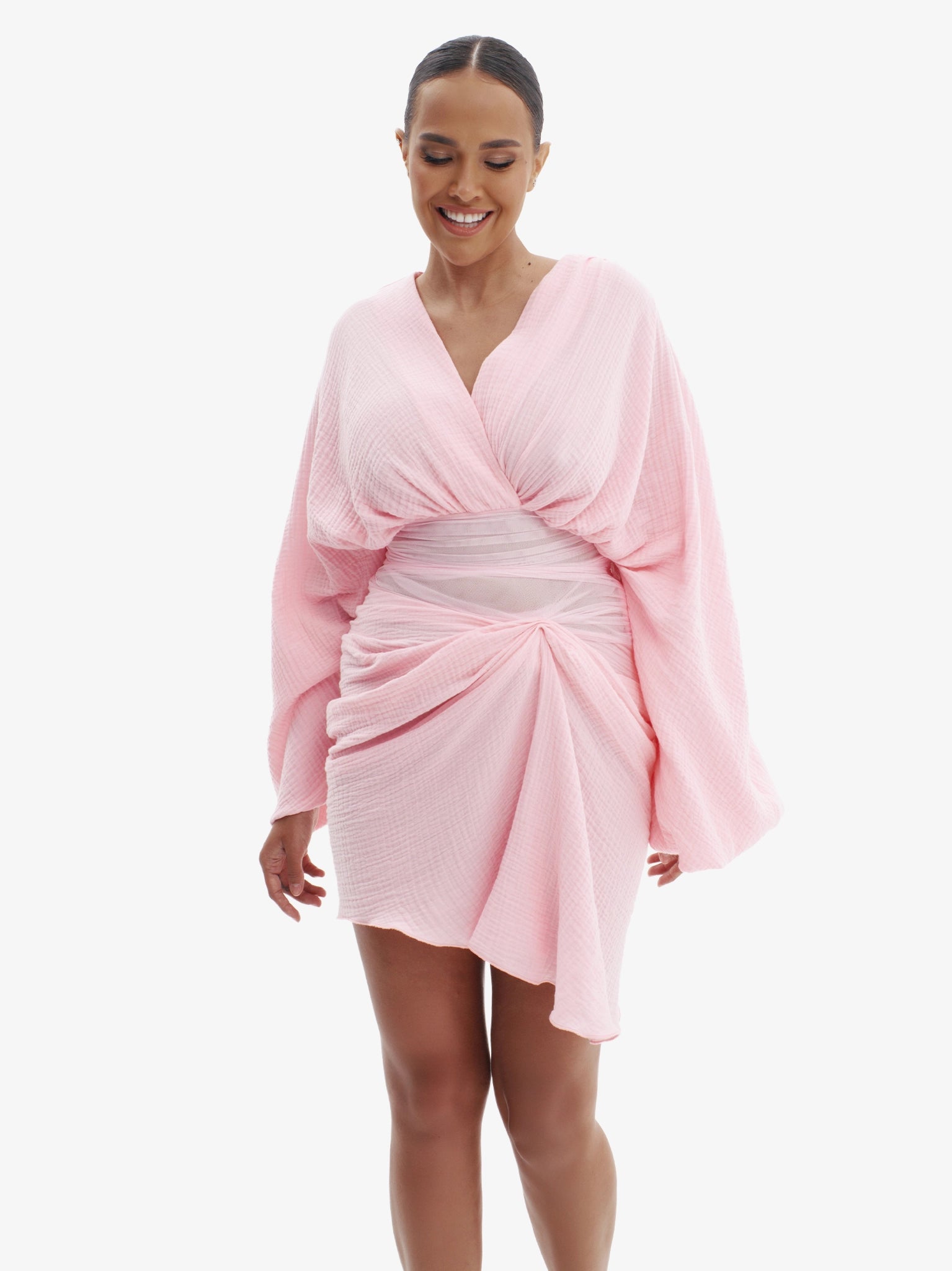 Pink draped dress with cinched waist, flattering minimalist elegance.