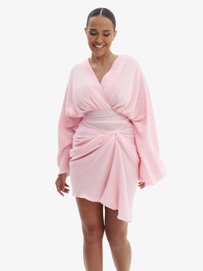 Pink draped dress with cinched waist, flattering minimalist elegance.