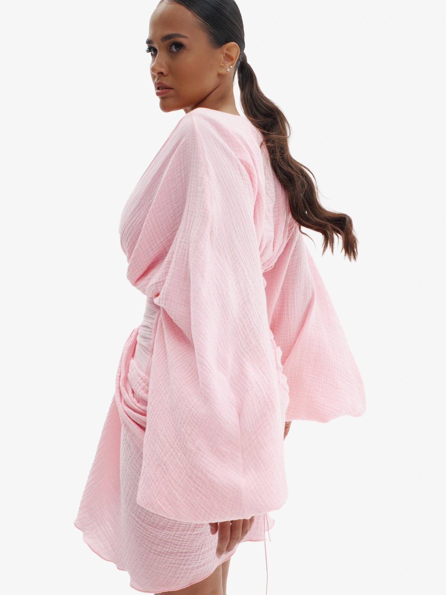 Pink draped dress with cinched waist, flattering minimalist elegance.