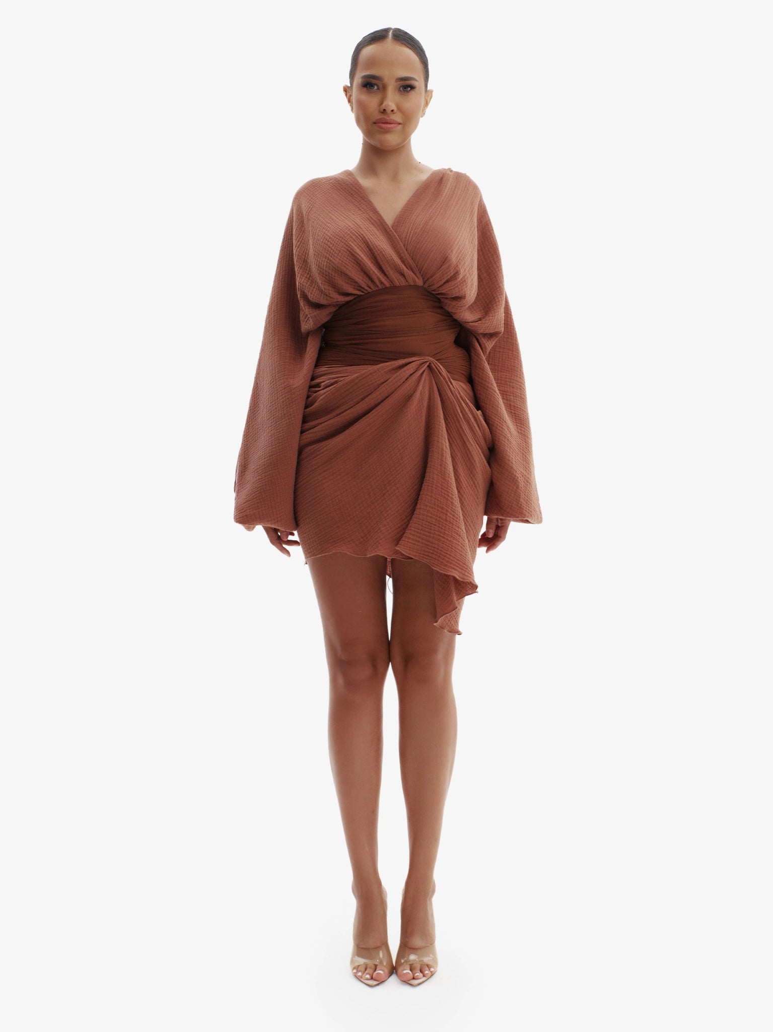Brown draped dress with cinched waist, flattering minimalist elegance.