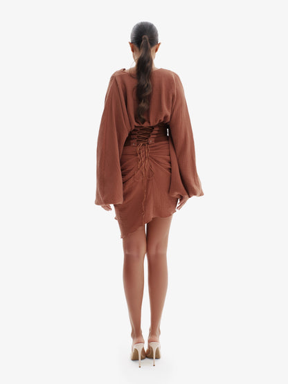 Brown draped dress with cinched waist, flattering minimalist elegance.