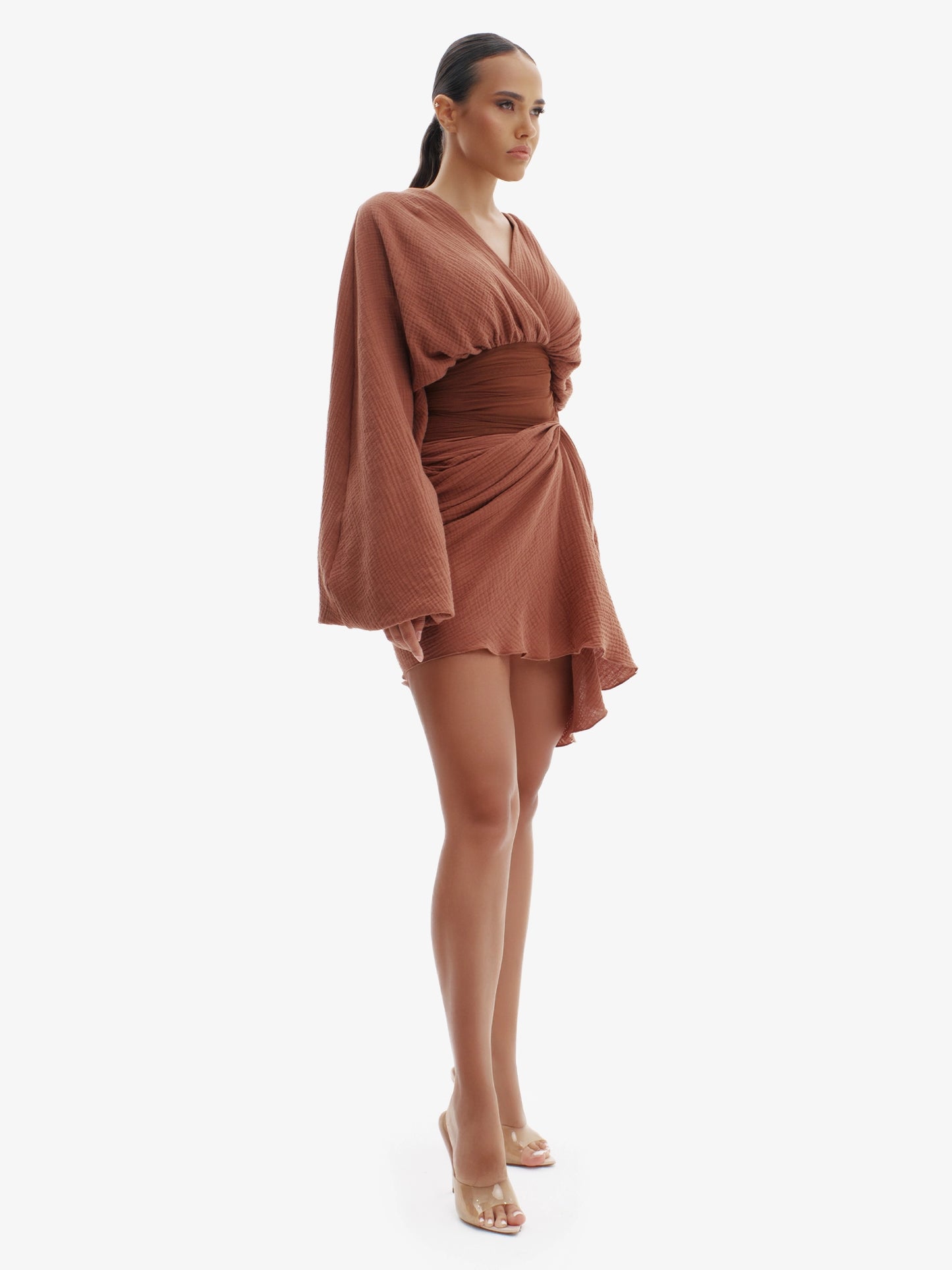 Brown draped dress with cinched waist, flattering minimalist elegance.