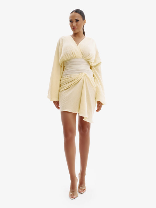 Pastel Yellow draped dress with cinched waist, flattering minimalist elegance.