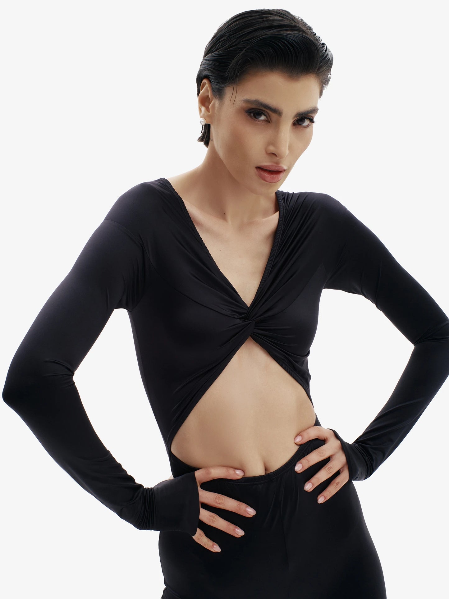 Black statement jumpsuit, unapologetic style, confident luxury fashion.