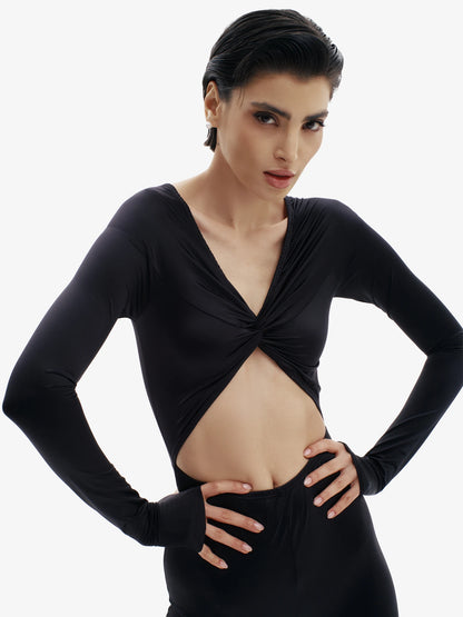 Black statement jumpsuit, unapologetic style, confident luxury fashion.