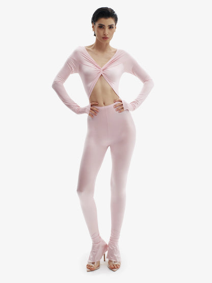 Pastel Pink statement jumpsuit, unapologetic style, confident luxury fashion.