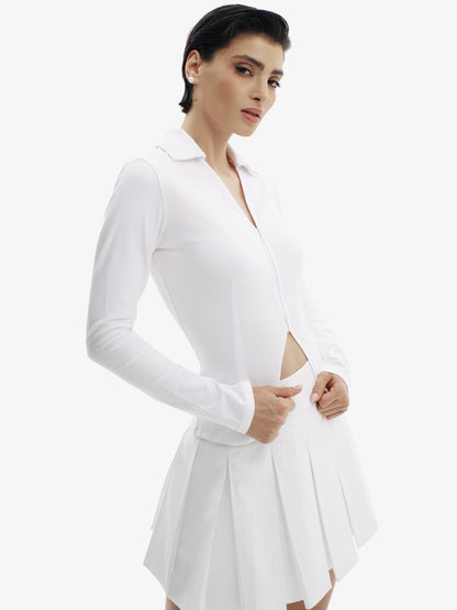 White tennis skirt, elevated athletic style, comfortable luxury minimalist athletic wear.
