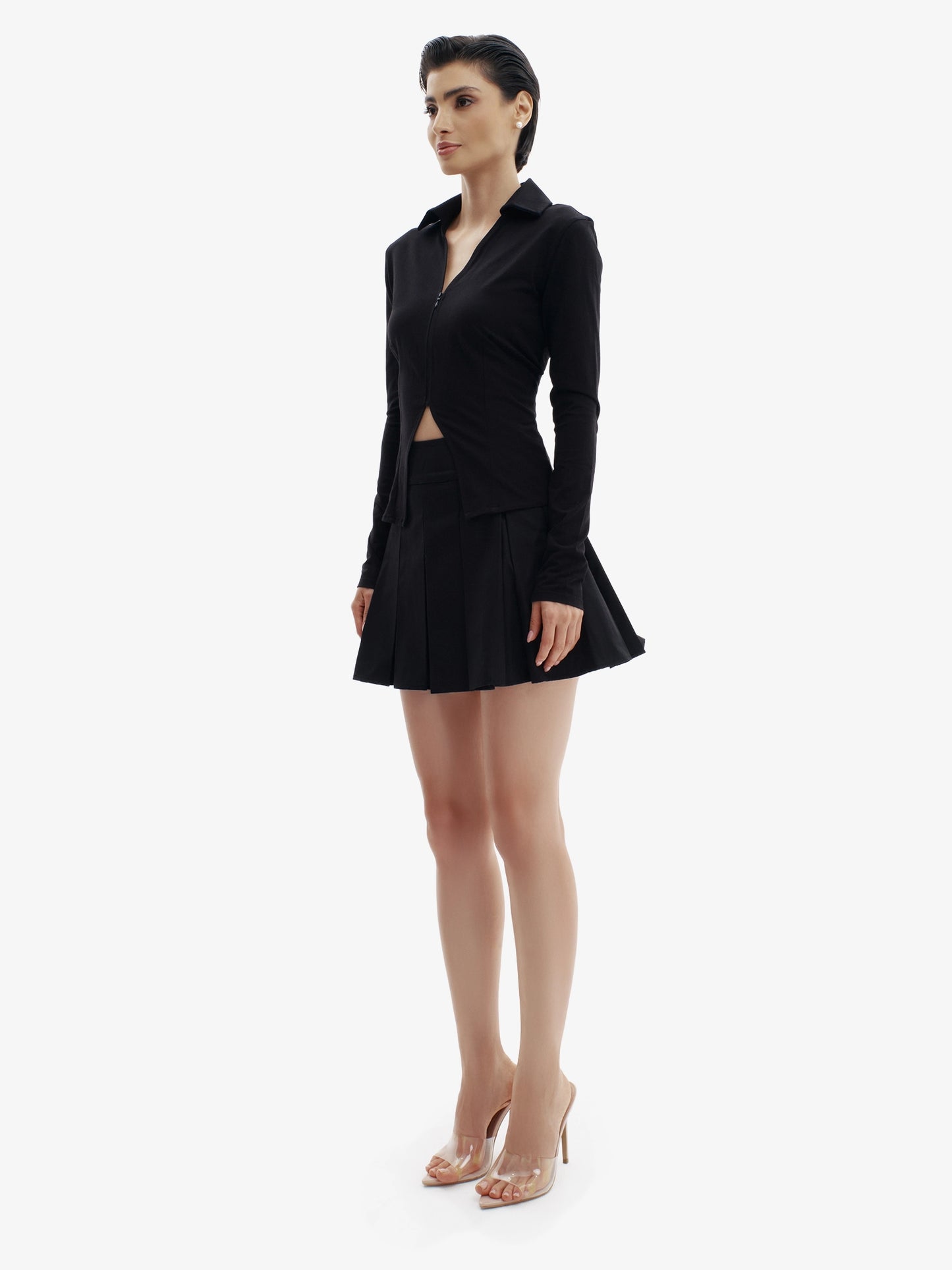 Black tennis skirt, elevated sport-chic, comfortable luxury minimalist athletic wear.