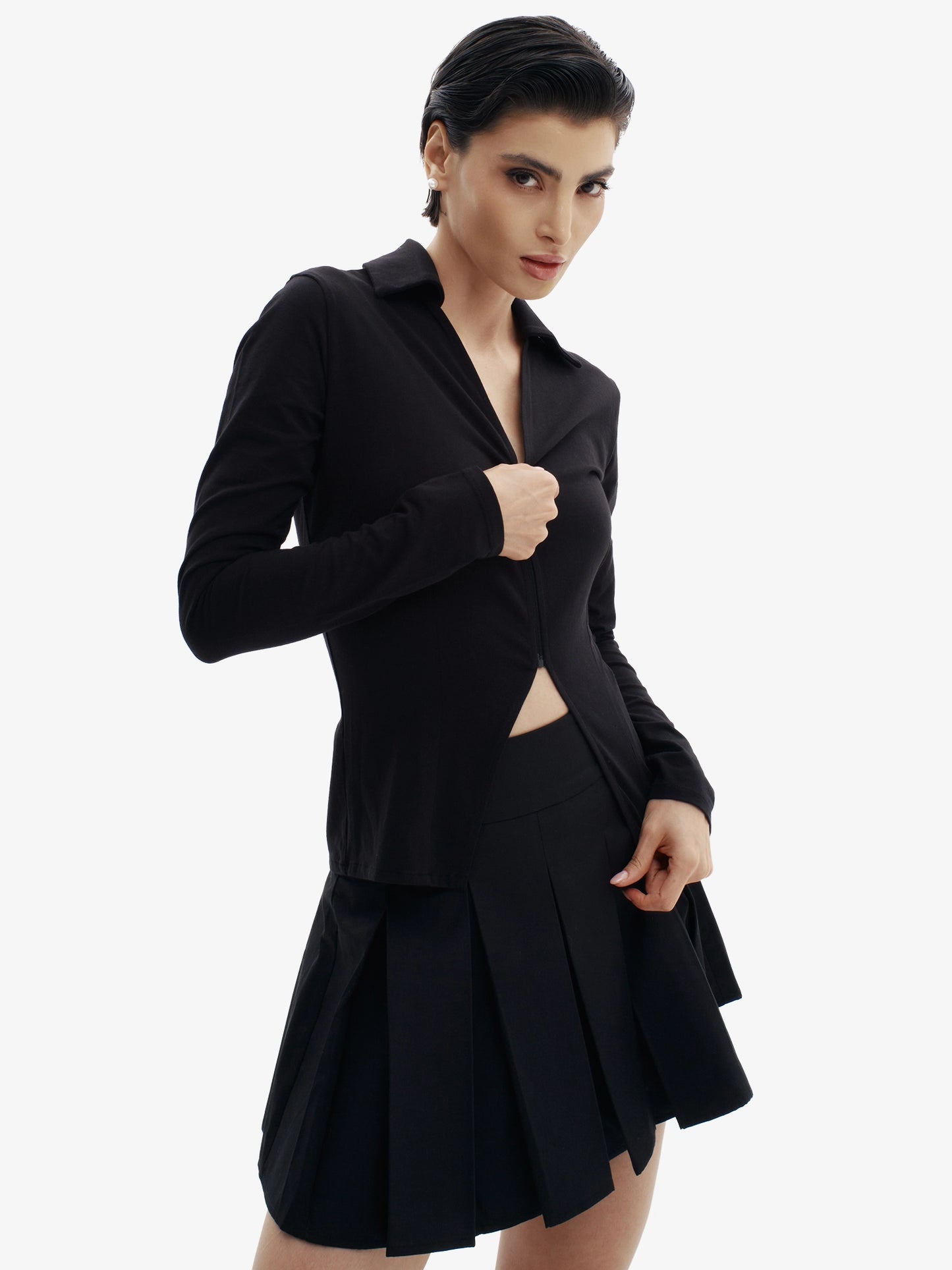 Black tennis skirt, elevated sport-chic, comfortable luxury minimalist athletic wear.