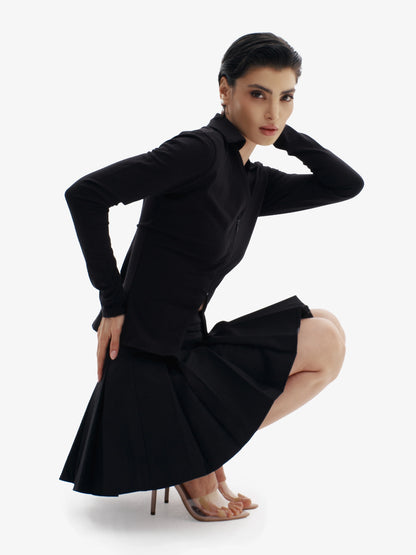 Black tennis skirt, elevated sport-chic, comfortable luxury minimalist athletic wear.