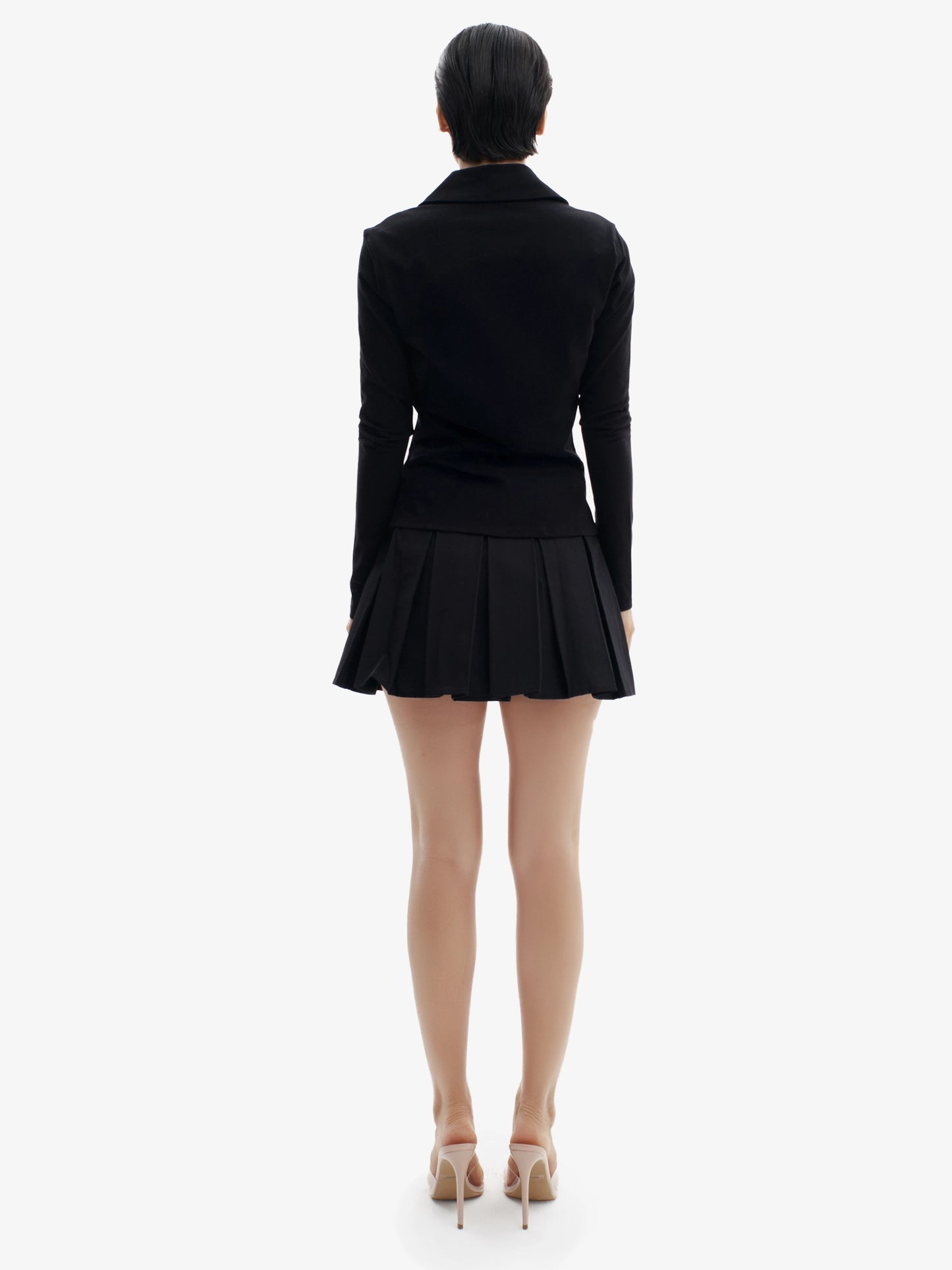 Black tennis skirt, elevated sport-chic, comfortable luxury minimalist athletic wear.