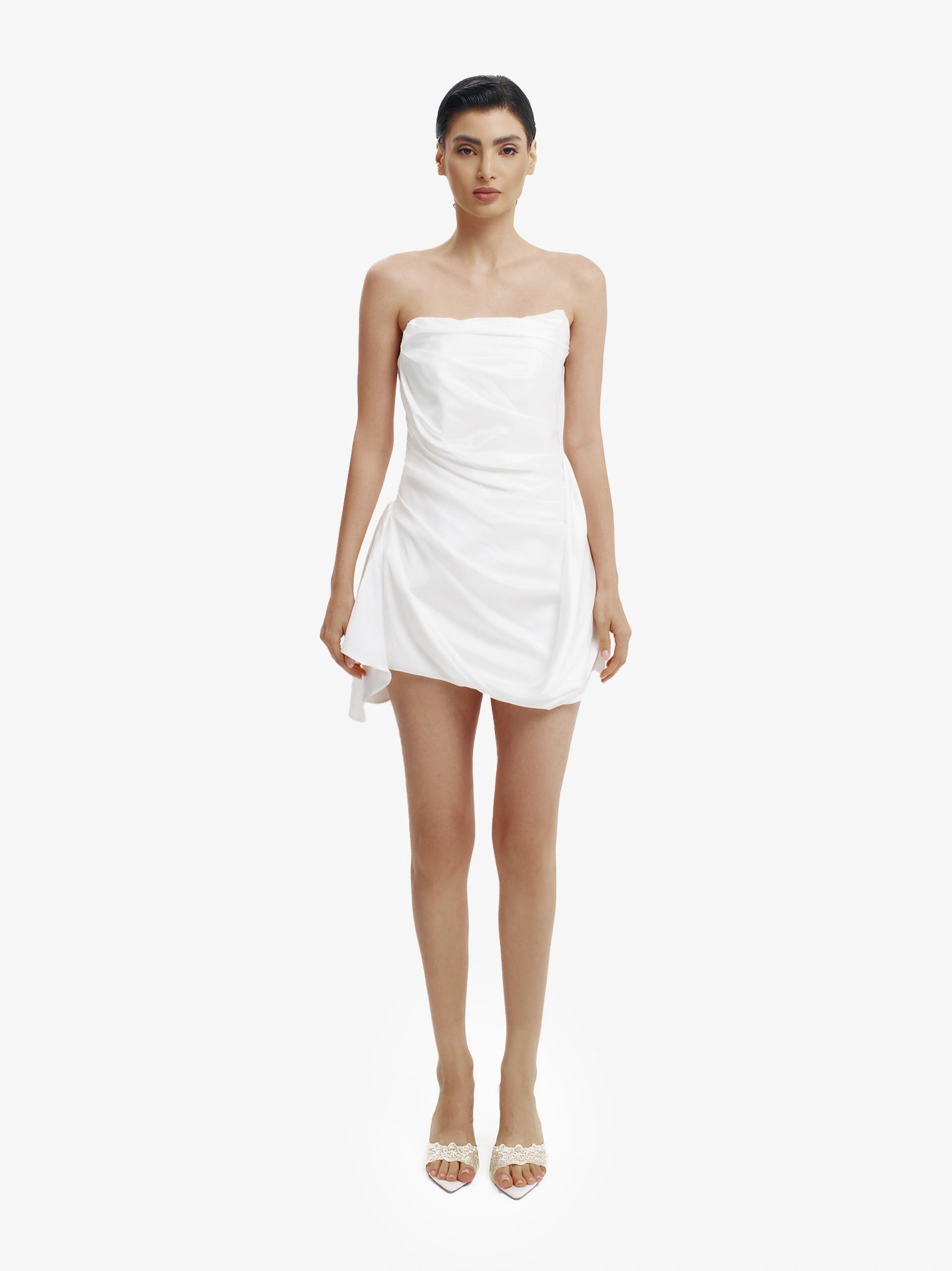 White statement mini dress, chic and daring, minimalist luxury party wear.