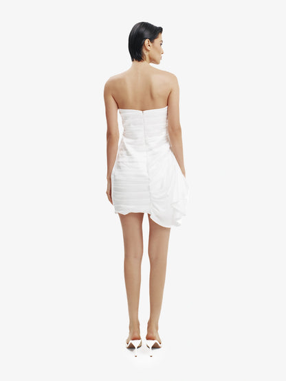White statement mini dress, chic and daring, minimalist luxury party wear.
