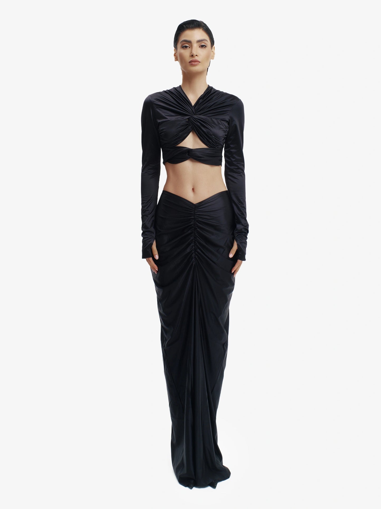 Black twisted knot maxi skirt, effortless draping, unique minimalist style.

