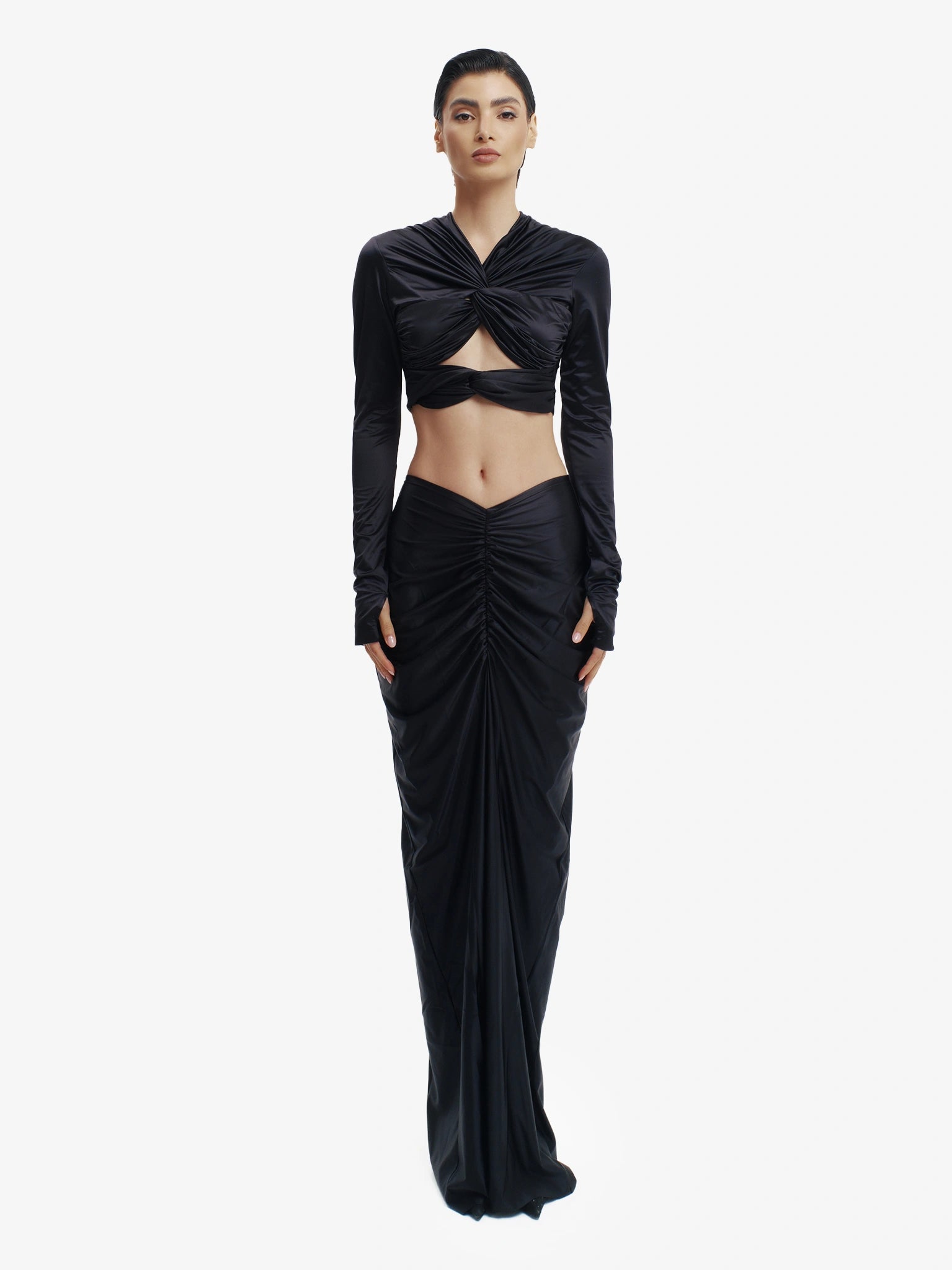 Black twisted knot maxi skirt, effortless draping, unique minimalist style.
