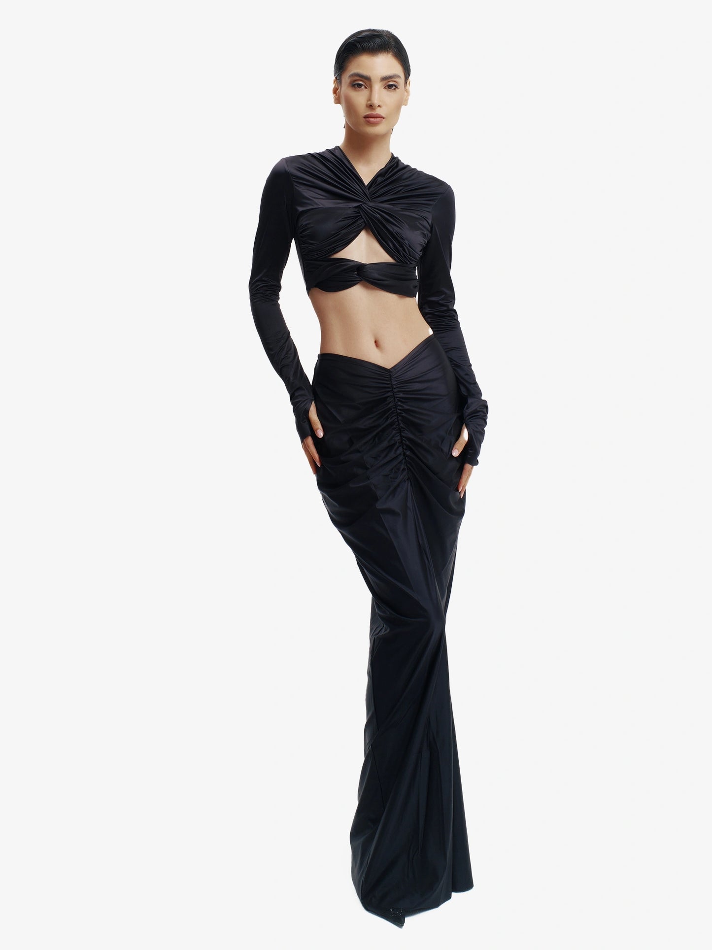 Black twisted knot maxi skirt, effortless draping, unique minimalist style.