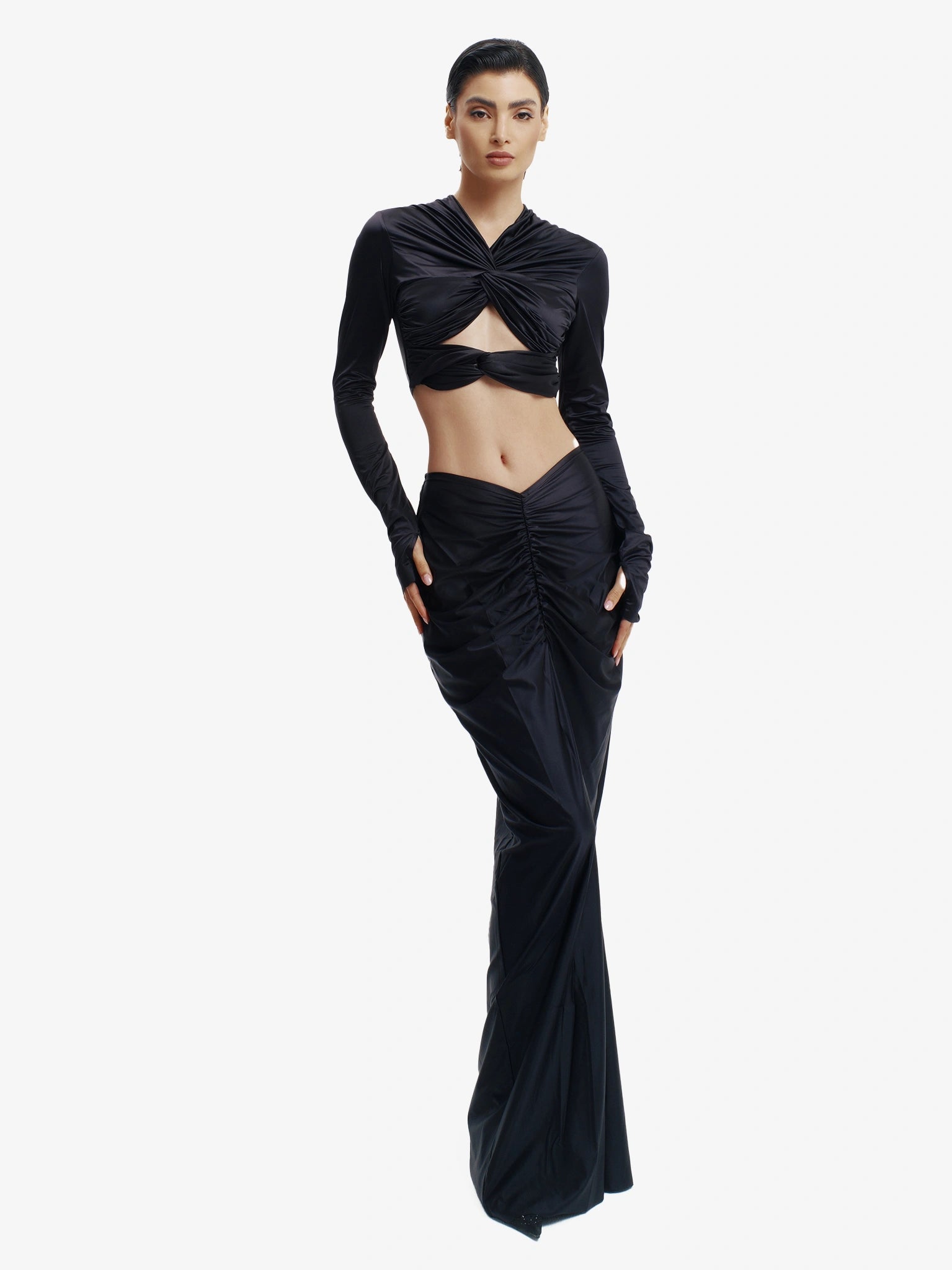 Black twisted knot maxi skirt, effortless draping, unique minimalist style.