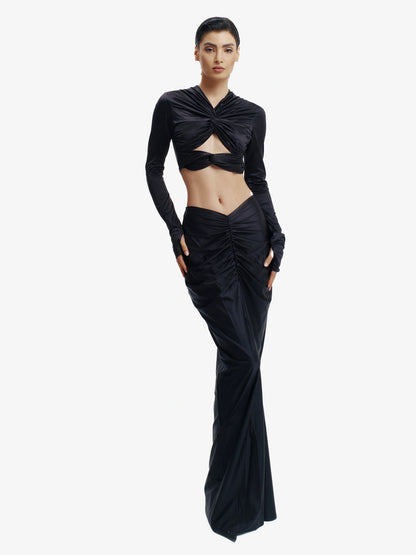Black twisted knot maxi skirt, effortless draping, unique minimalist style.