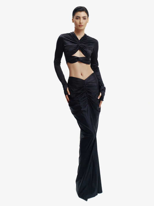 Black twisted knot maxi skirt, effortless draping, unique minimalist style.