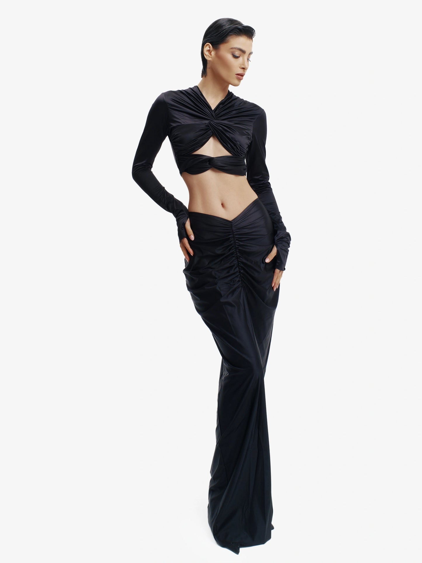 Black twisted knot maxi skirt, effortless draping, unique minimalist style.