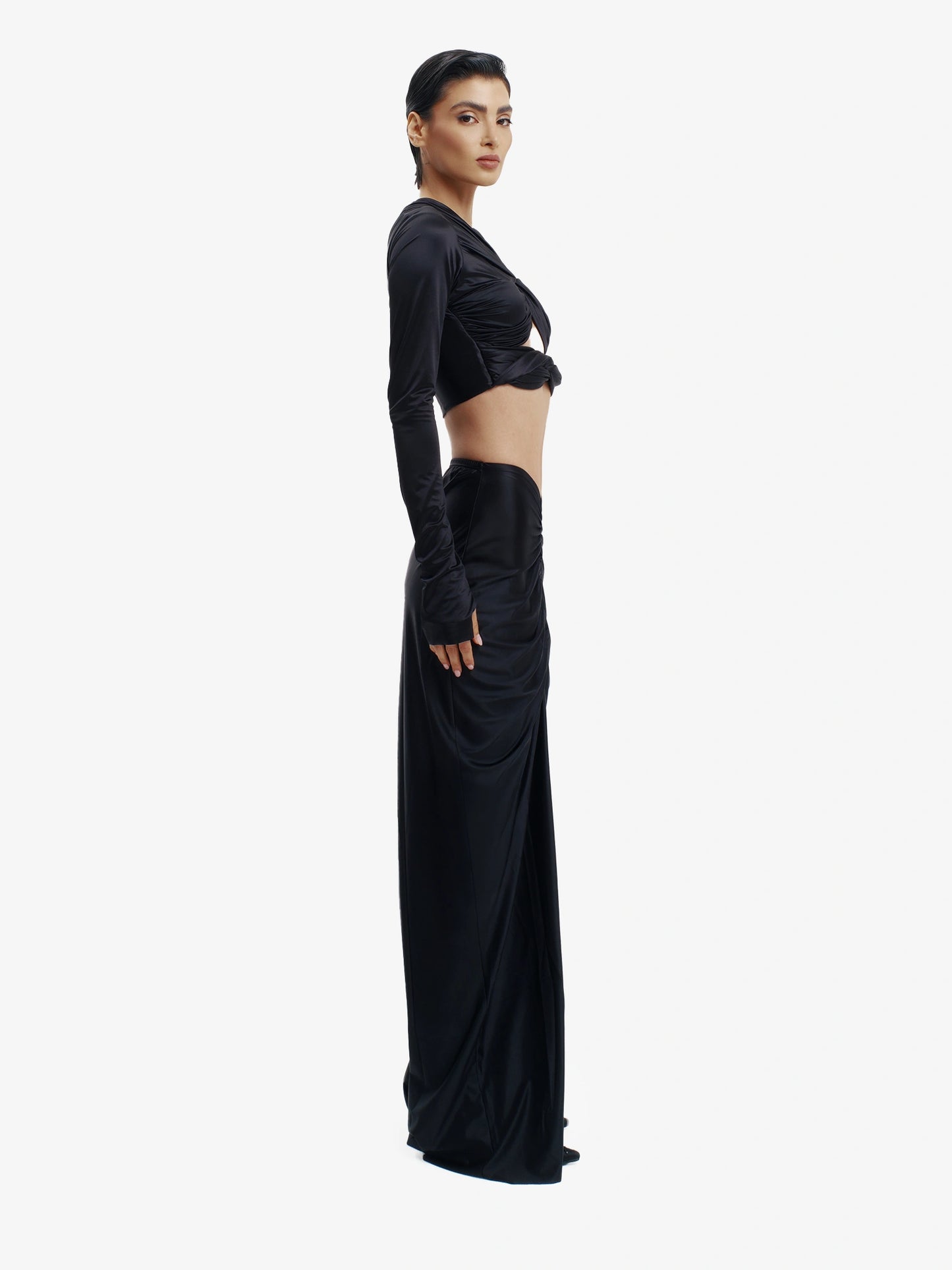 Black twisted knot maxi skirt, effortless draping, unique minimalist style.