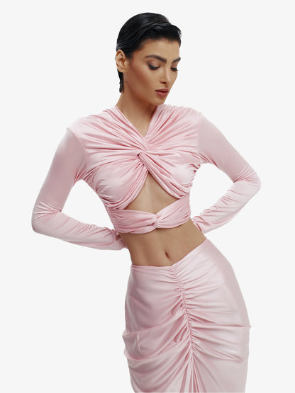 Pink twisted knot maxi skirt, effortless draping, unique minimalist style.