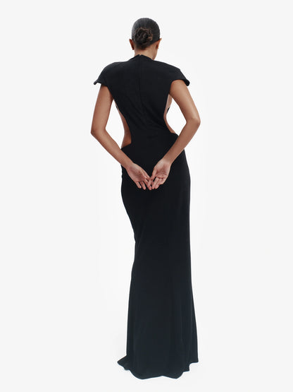 Black minimalist dress, unexpected side details, effortless modern chic.