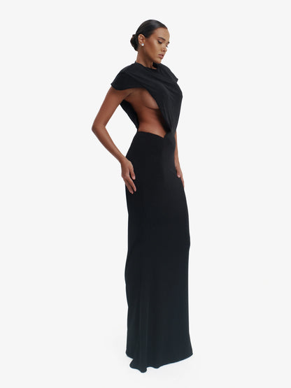 Black minimalist dress, unexpected side details, effortless modern chic.