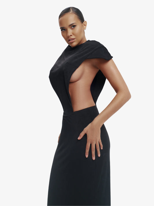 Black minimalist dress, unexpected side details, effortless modern chic.