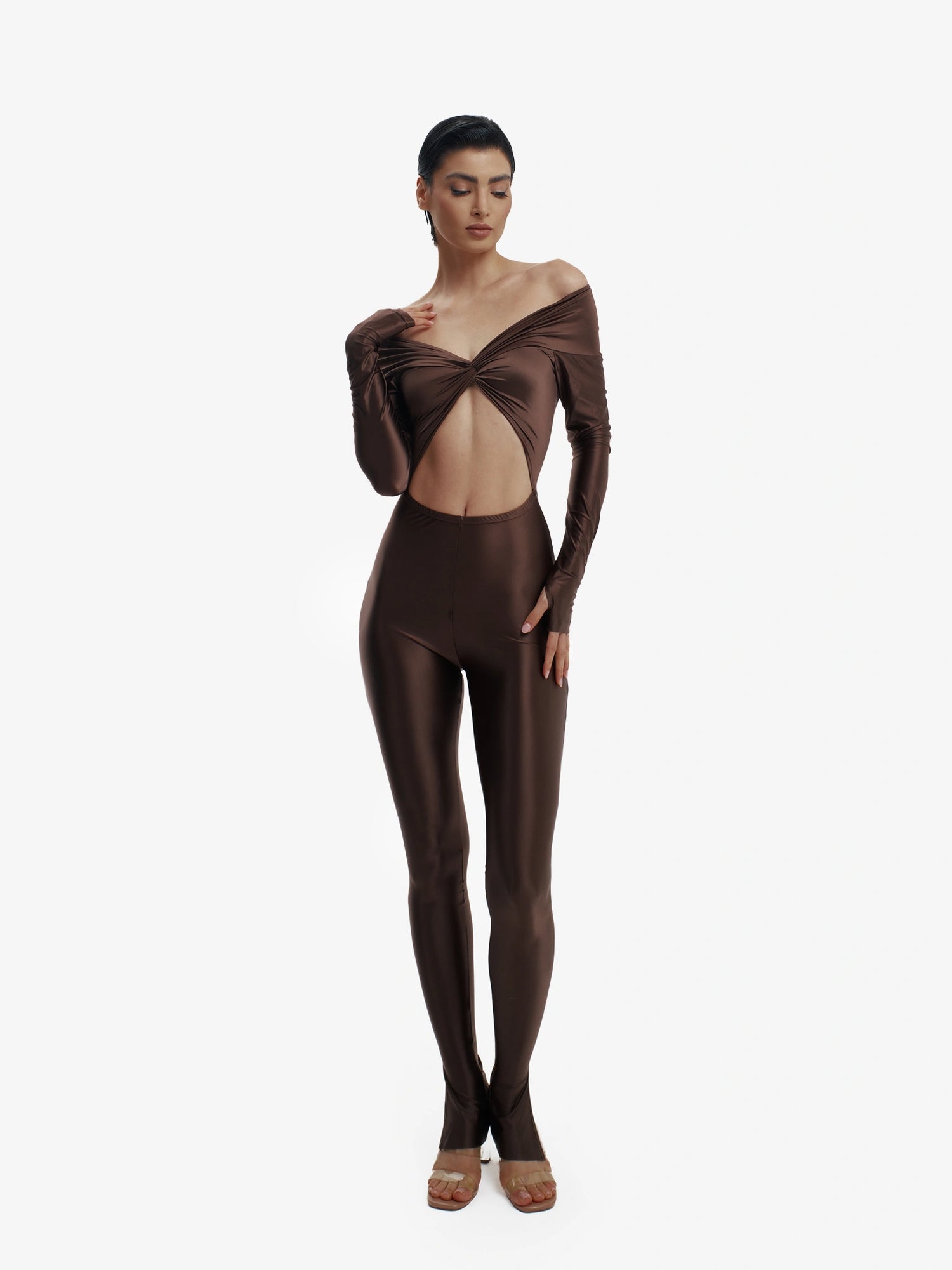 Brown statement jumpsuit, unapologetic style, confident luxury fashion.