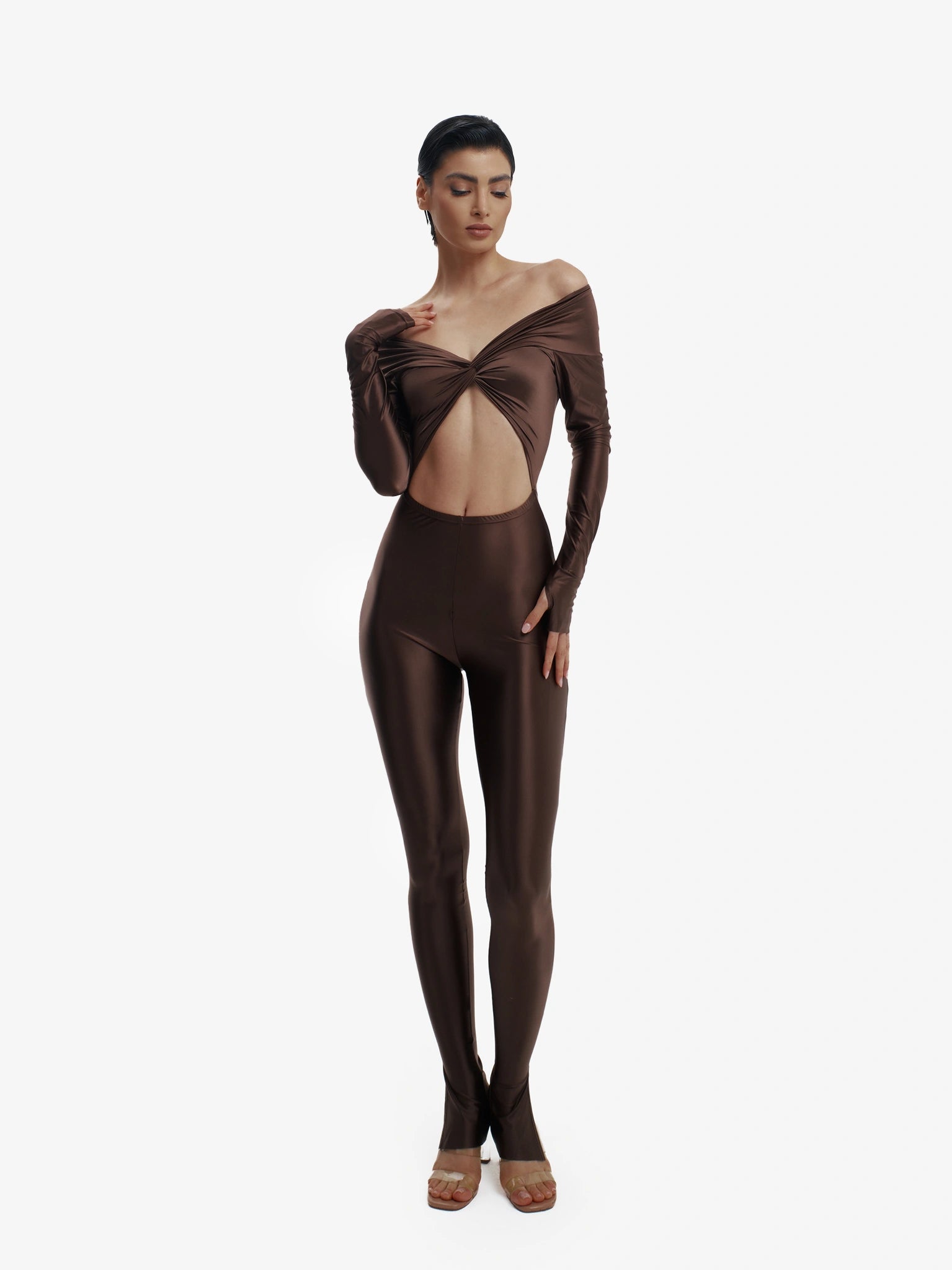 Brown statement jumpsuit, unapologetic style, confident luxury fashion.