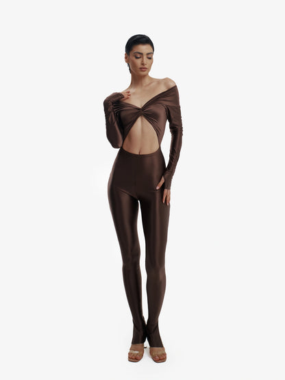 Brown statement jumpsuit, unapologetic style, confident luxury fashion.