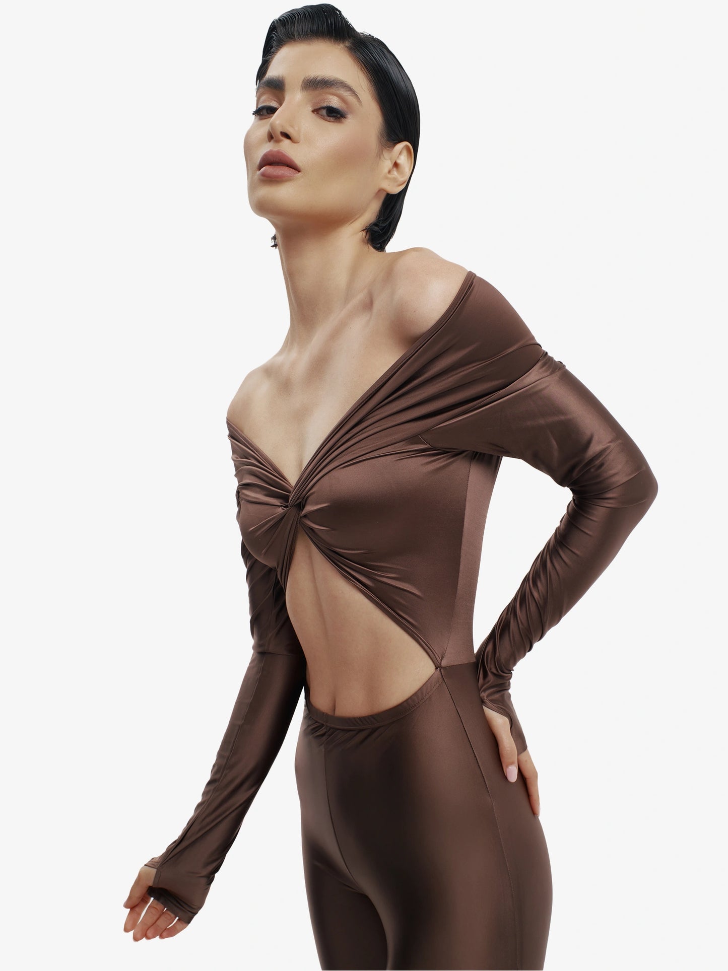 Brown statement jumpsuit, unapologetic style, confident luxury fashion.