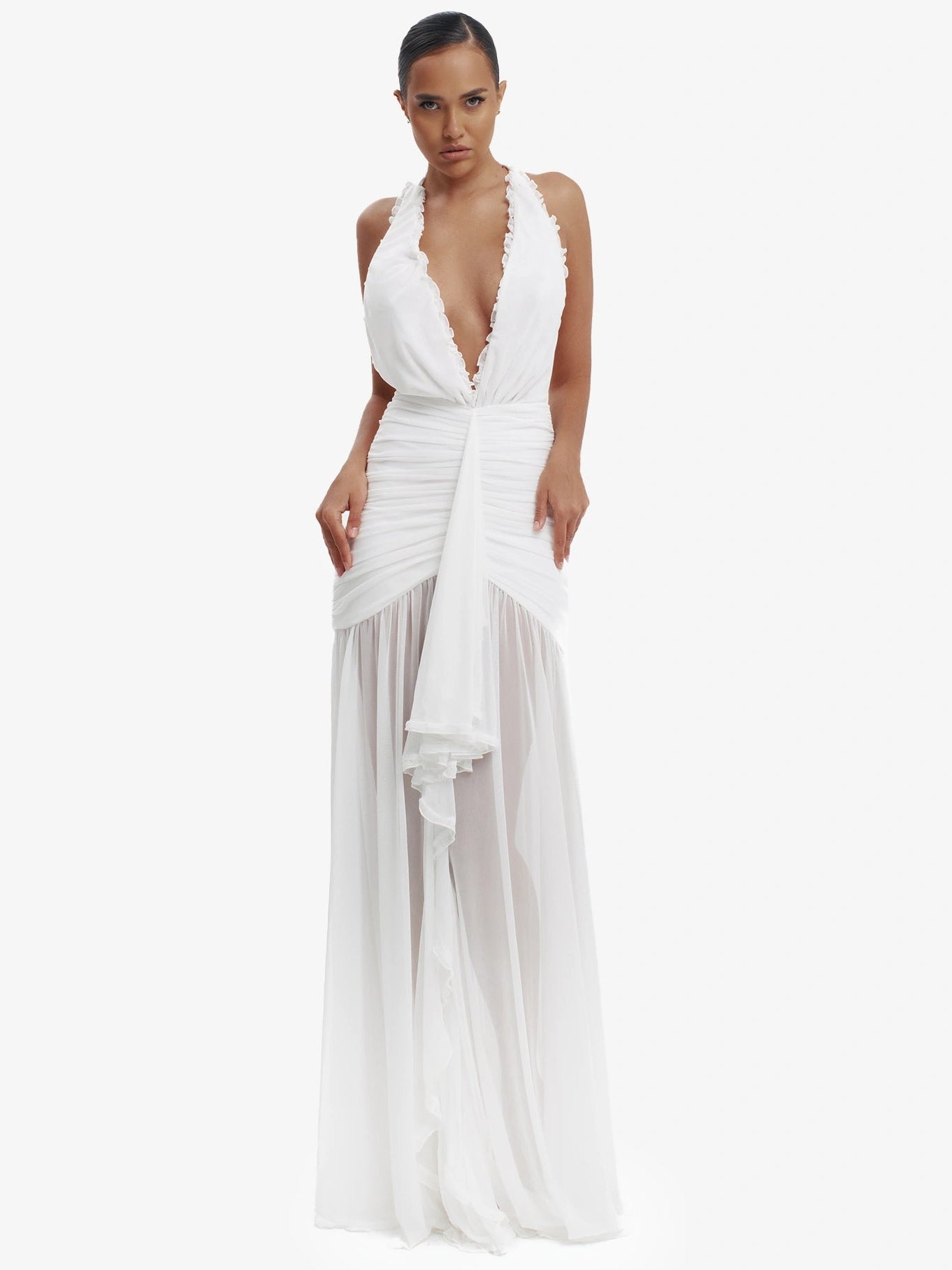 White dramatic mermaid dress, luxe evening wear, confident elegance.