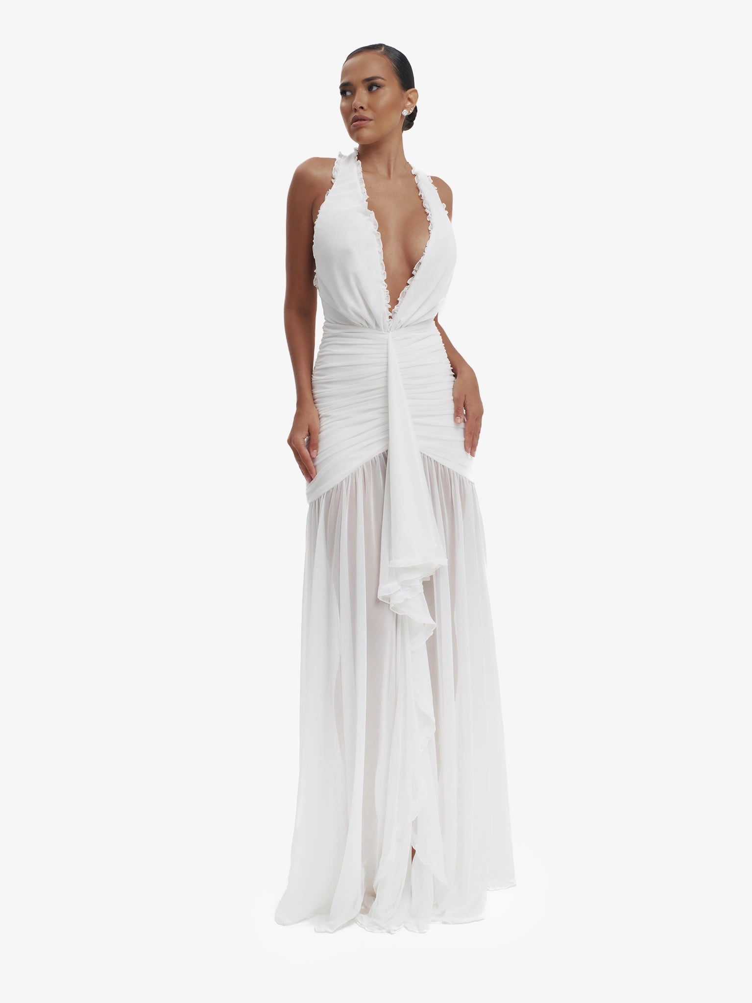White dramatic mermaid dress, luxe evening wear, confident elegance.