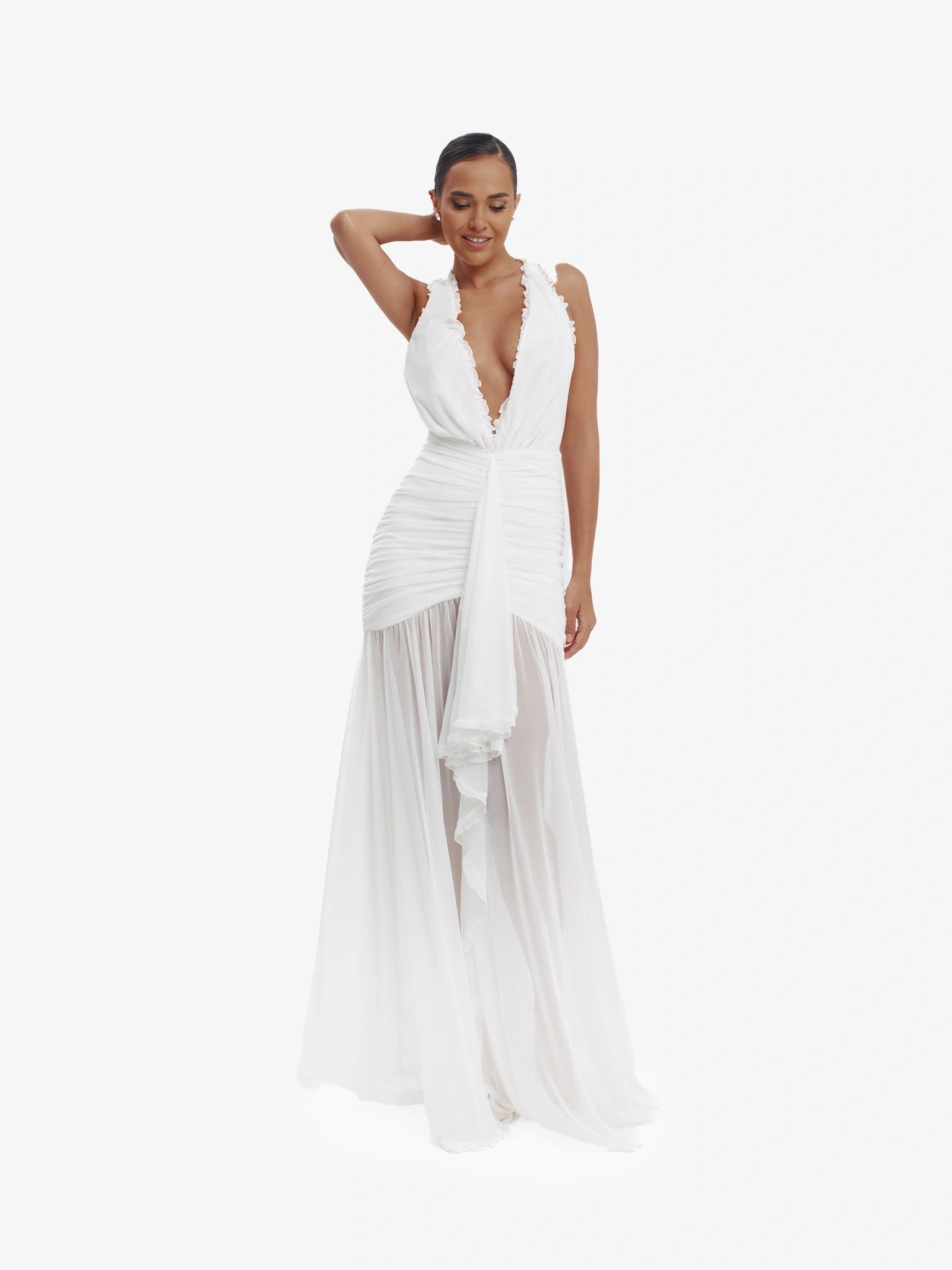 White dramatic mermaid dress, luxe evening wear, confident elegance.