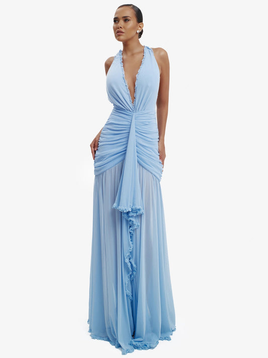 Blue dramatic mermaid dress, luxe evening wear, confident elegance.