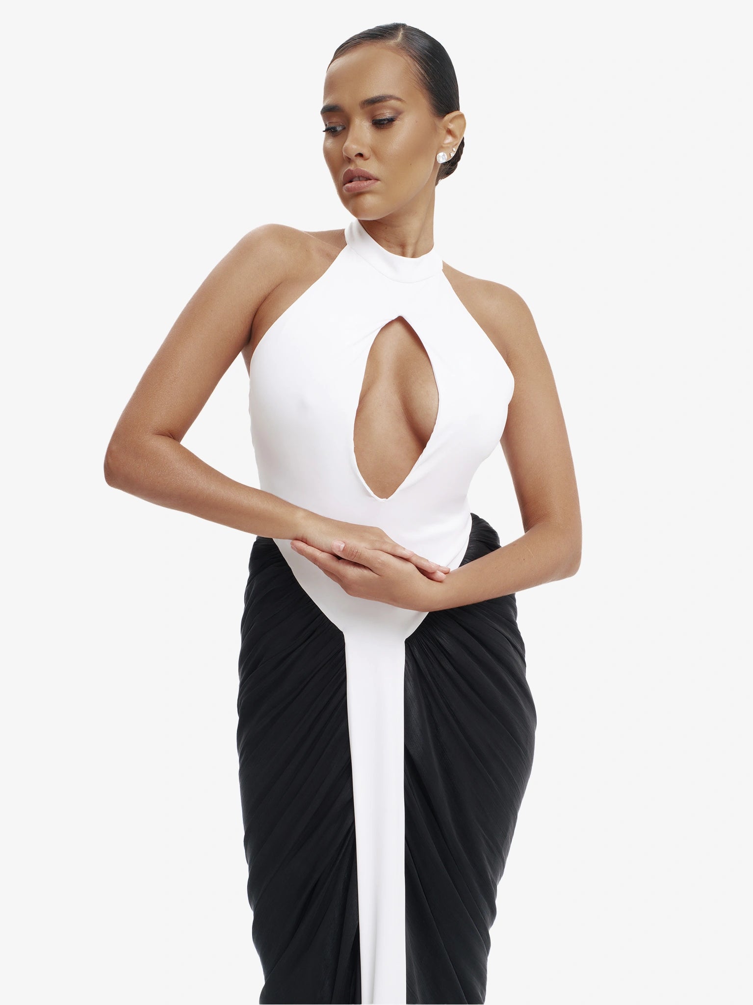 Black and white daring split-detail top, minimalist elegance, effortless modern chic.