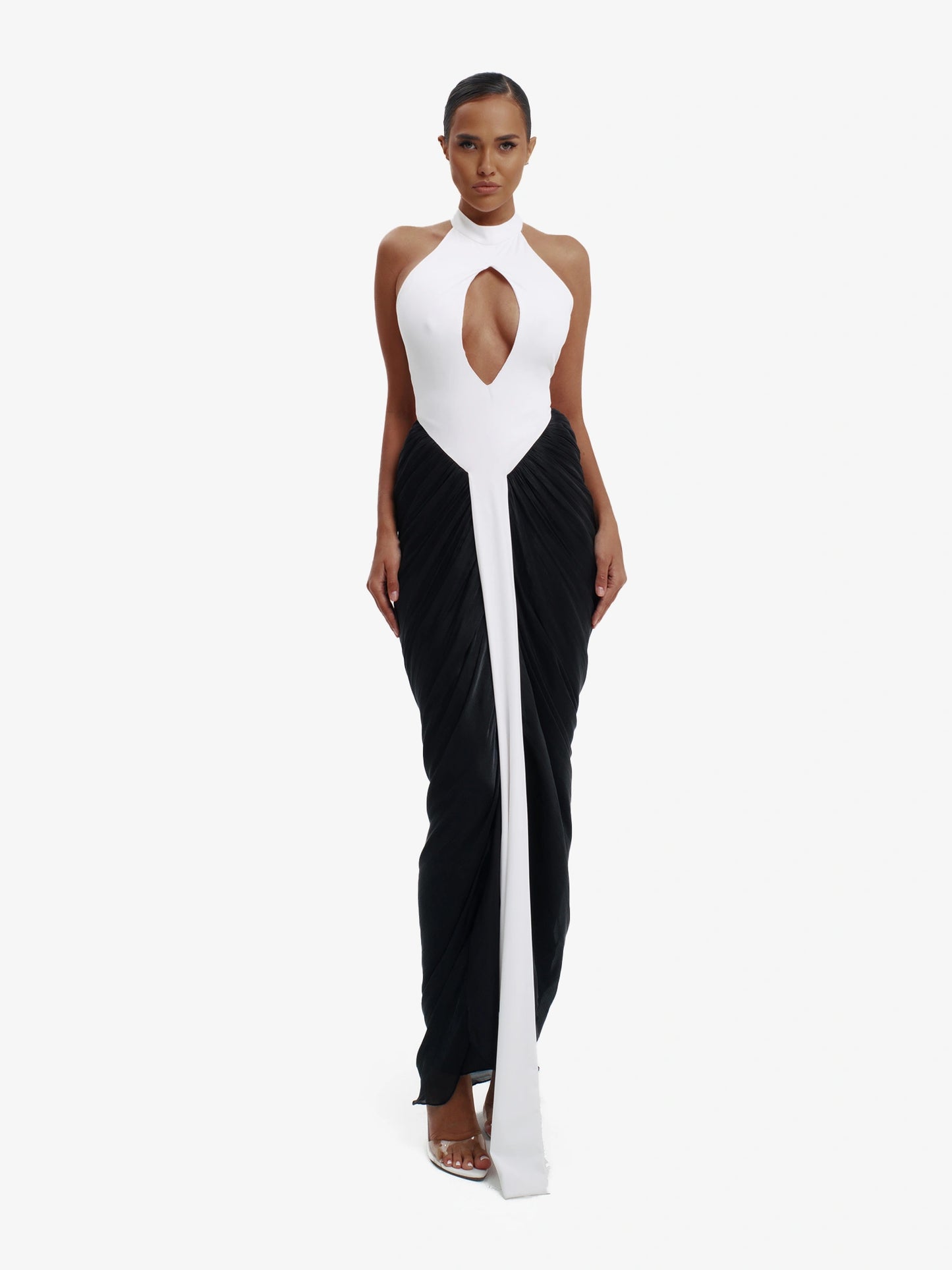 Black and white daring split-detail top, minimalist elegance, effortless modern chic.