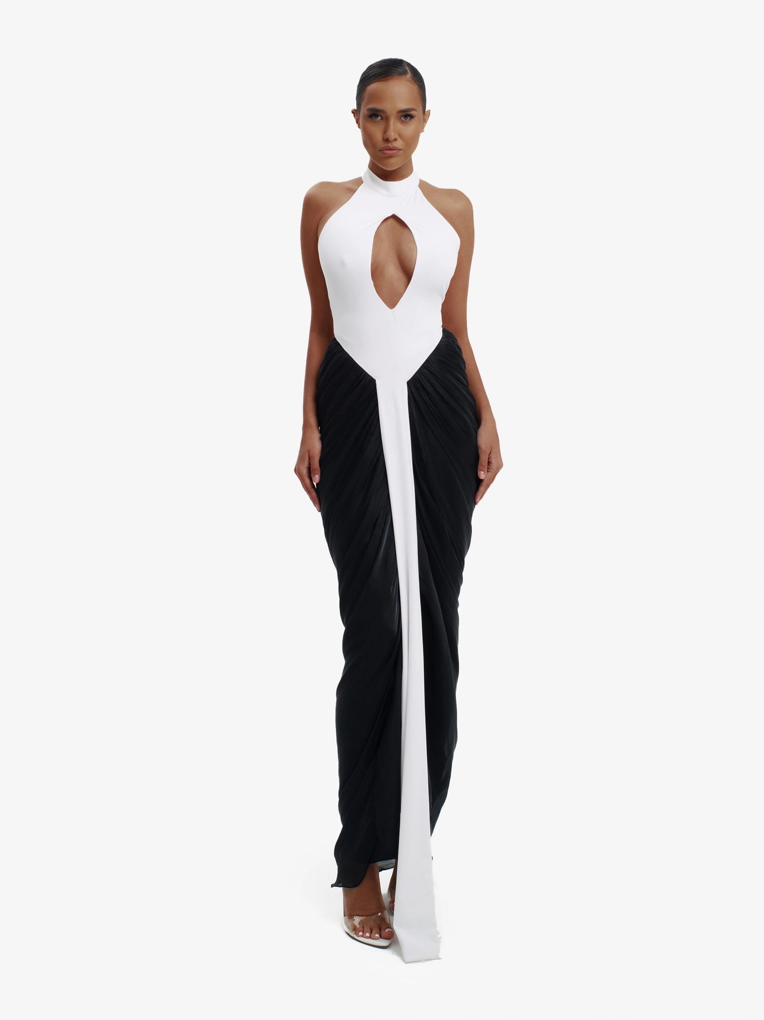 Black and white daring split-detail top, minimalist elegance, effortless modern chic.
