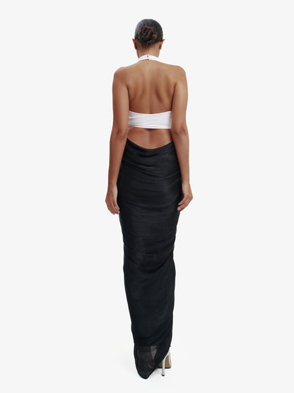 Black and white daring split-detail top, minimalist elegance, effortless modern chic.