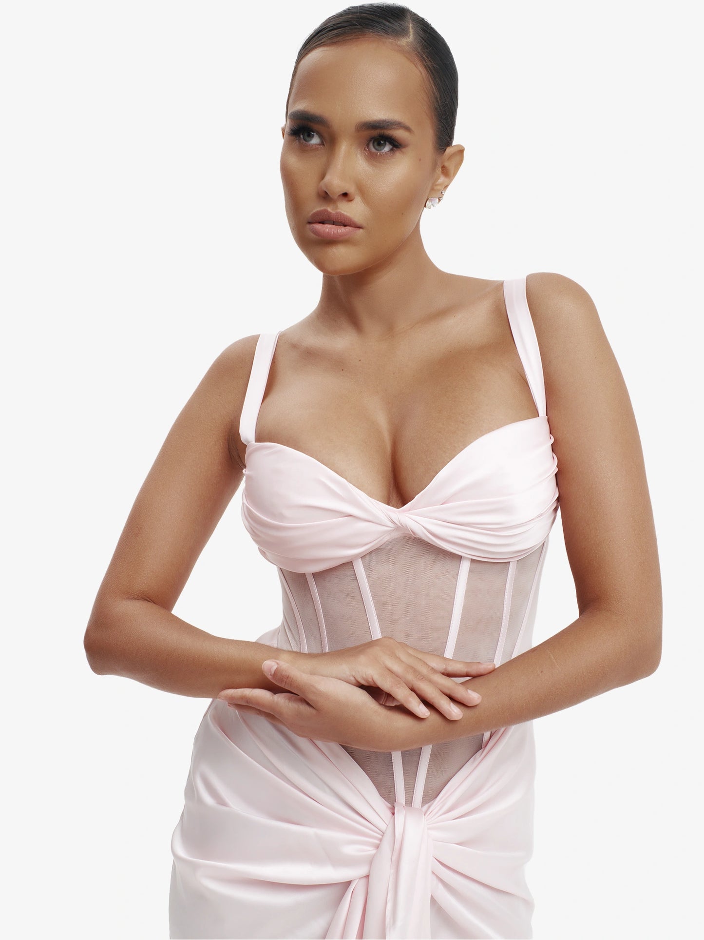 Pastel pink statement corset top, luxe structure, unapologetic luxury evening wear.